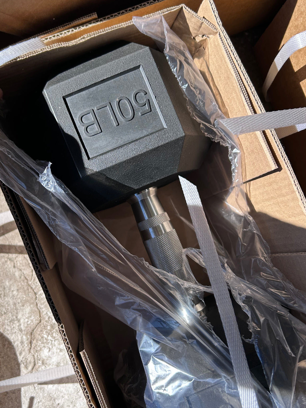 50 lb rubber hex dumbbell in shipping box